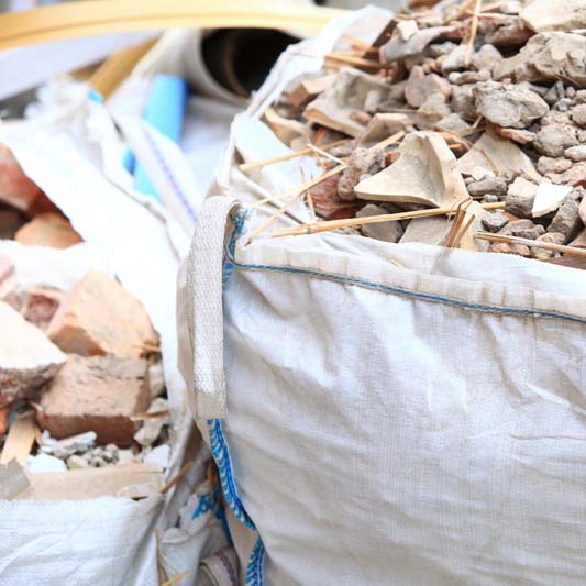 Full construction waste debris bags, garbage bricks and material from demolished house
